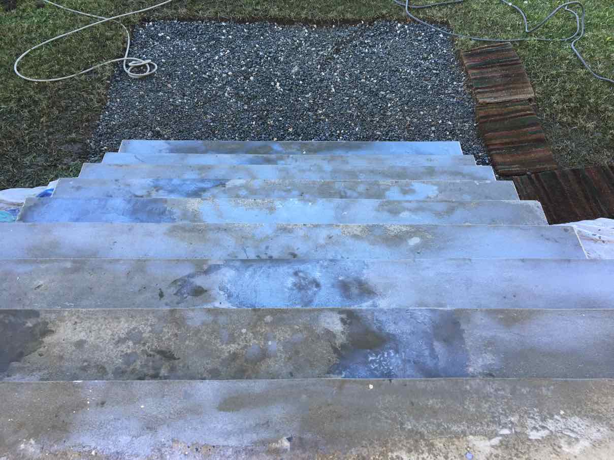 Spray crete coats being built up over the front steps of a Parramatta home