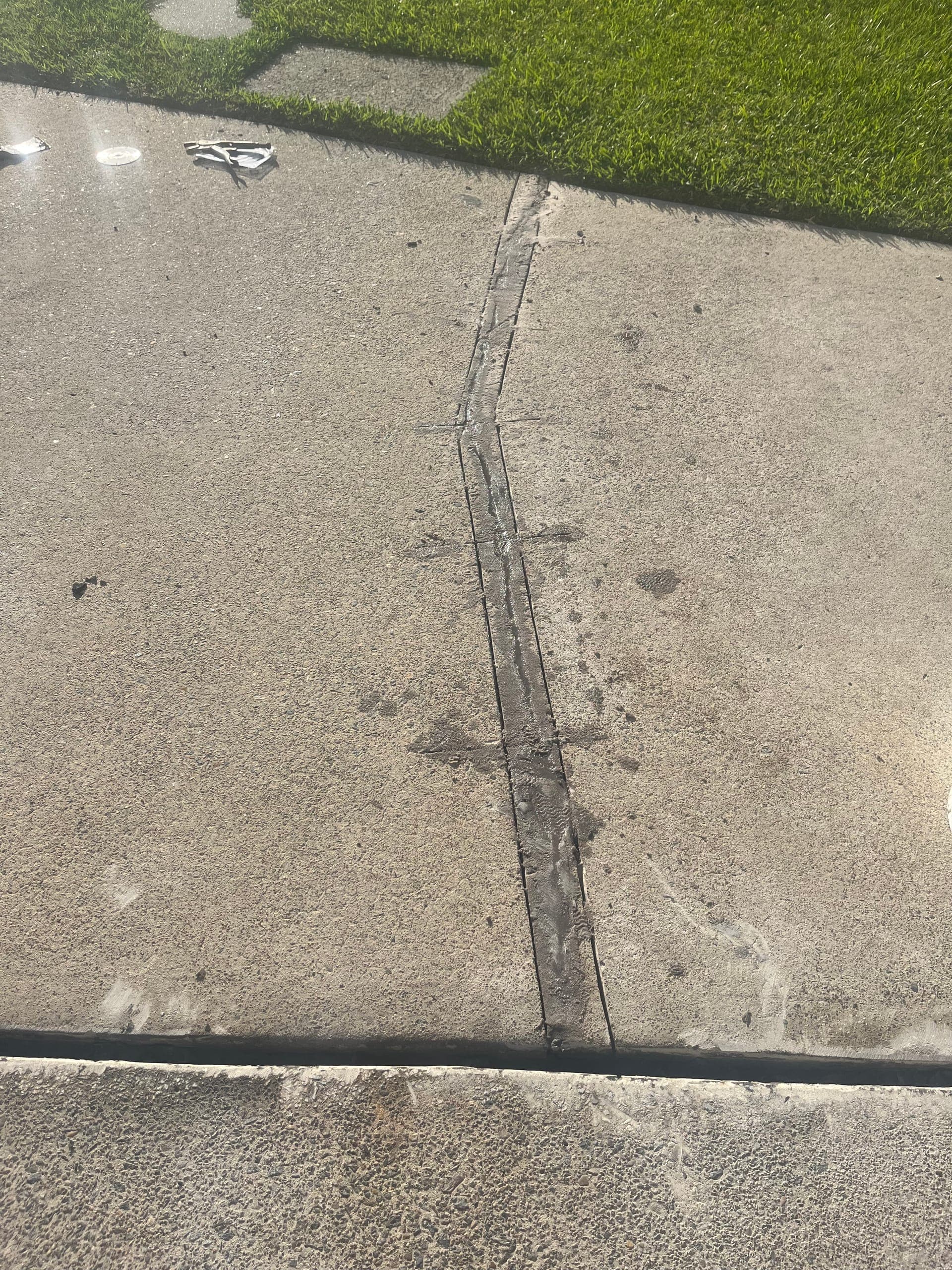 Greenacre repaired crack strip after resin and sand filling