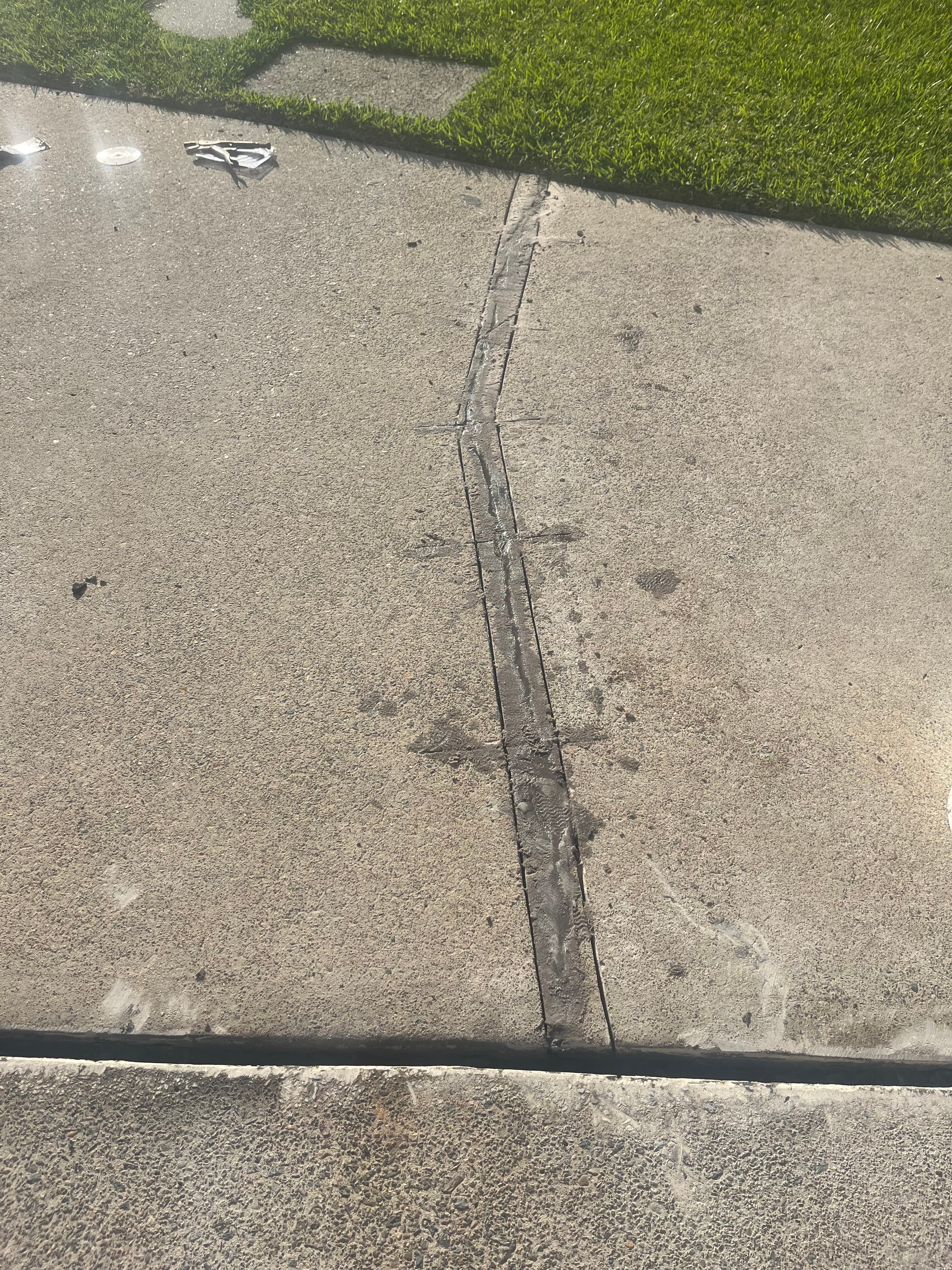 Greenacre repaired crack strip after resin and sand filling