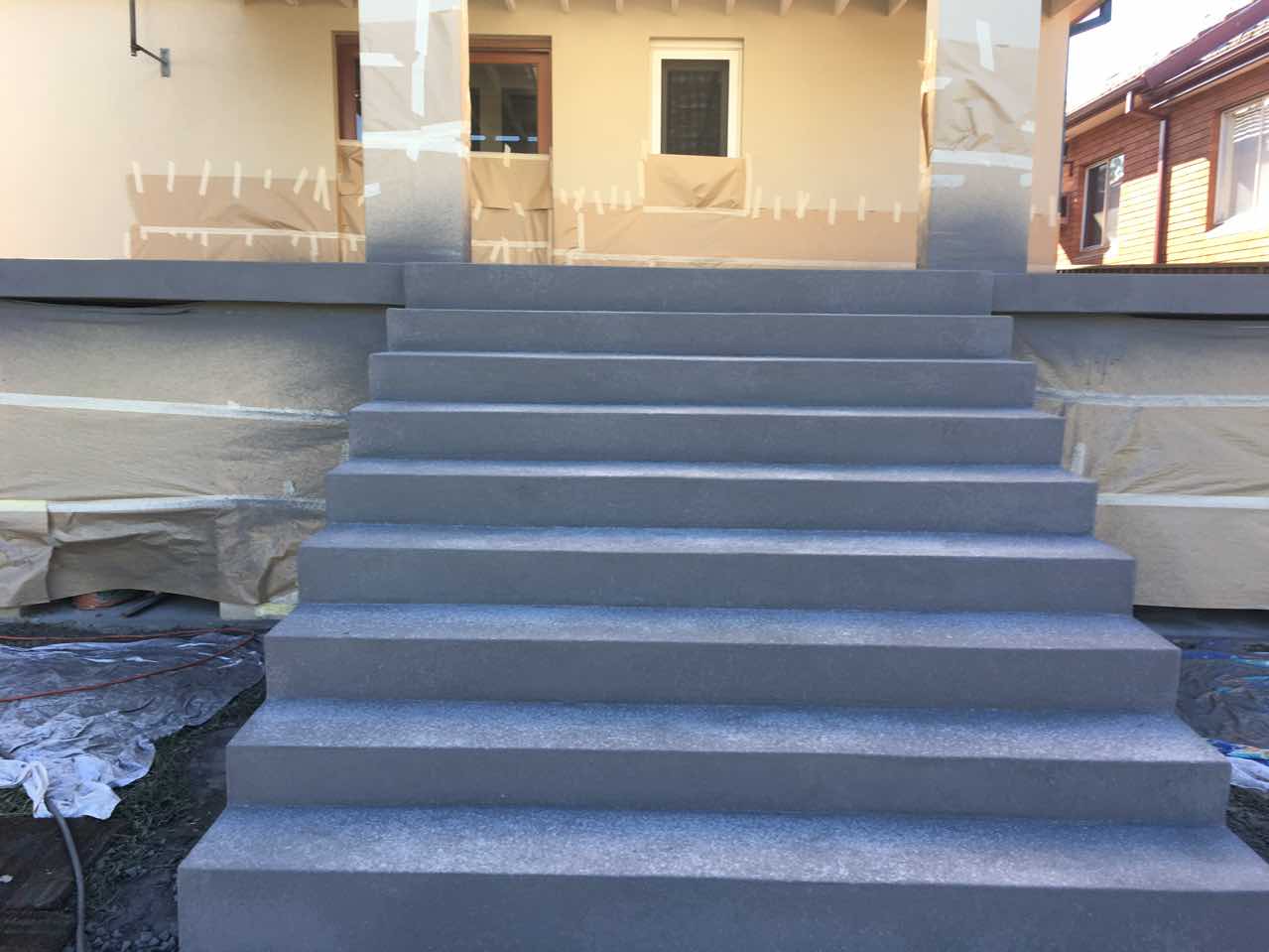 Finished speckled grey Spray Crete front entry steps in Parramatta