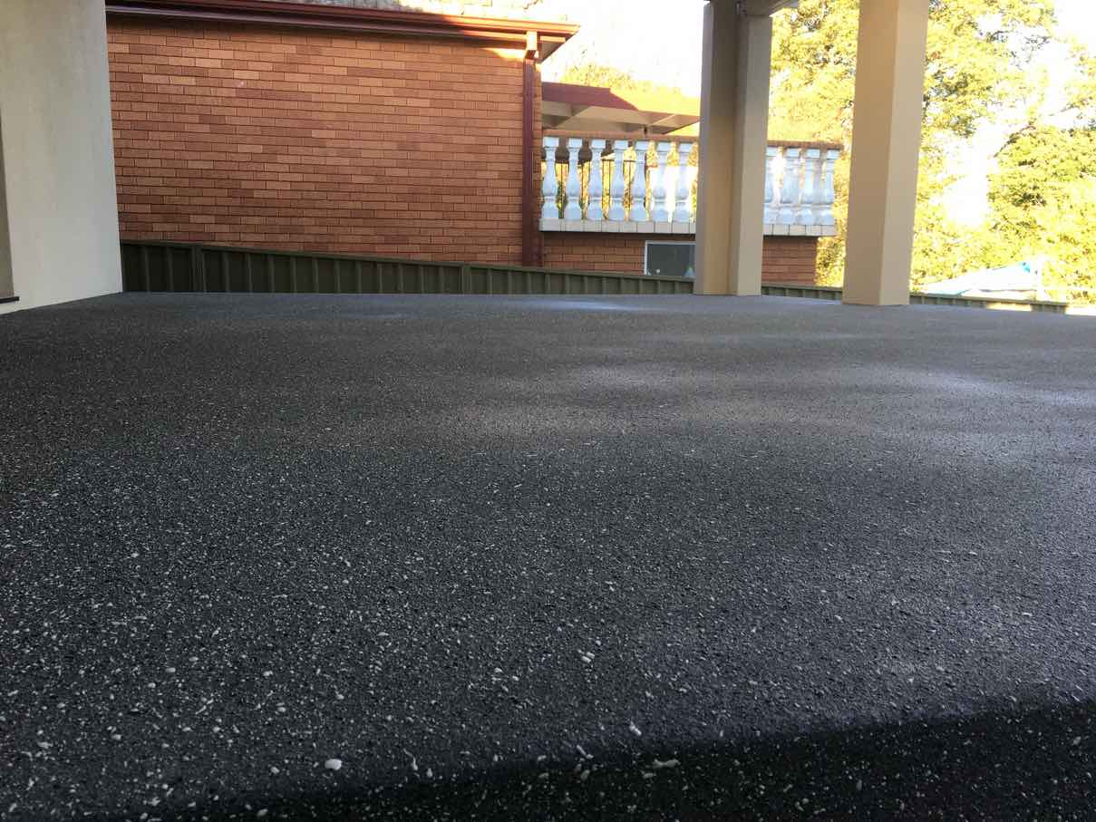 Close-up of the fine charcoal Spray Crete texture on the Parramatta patio