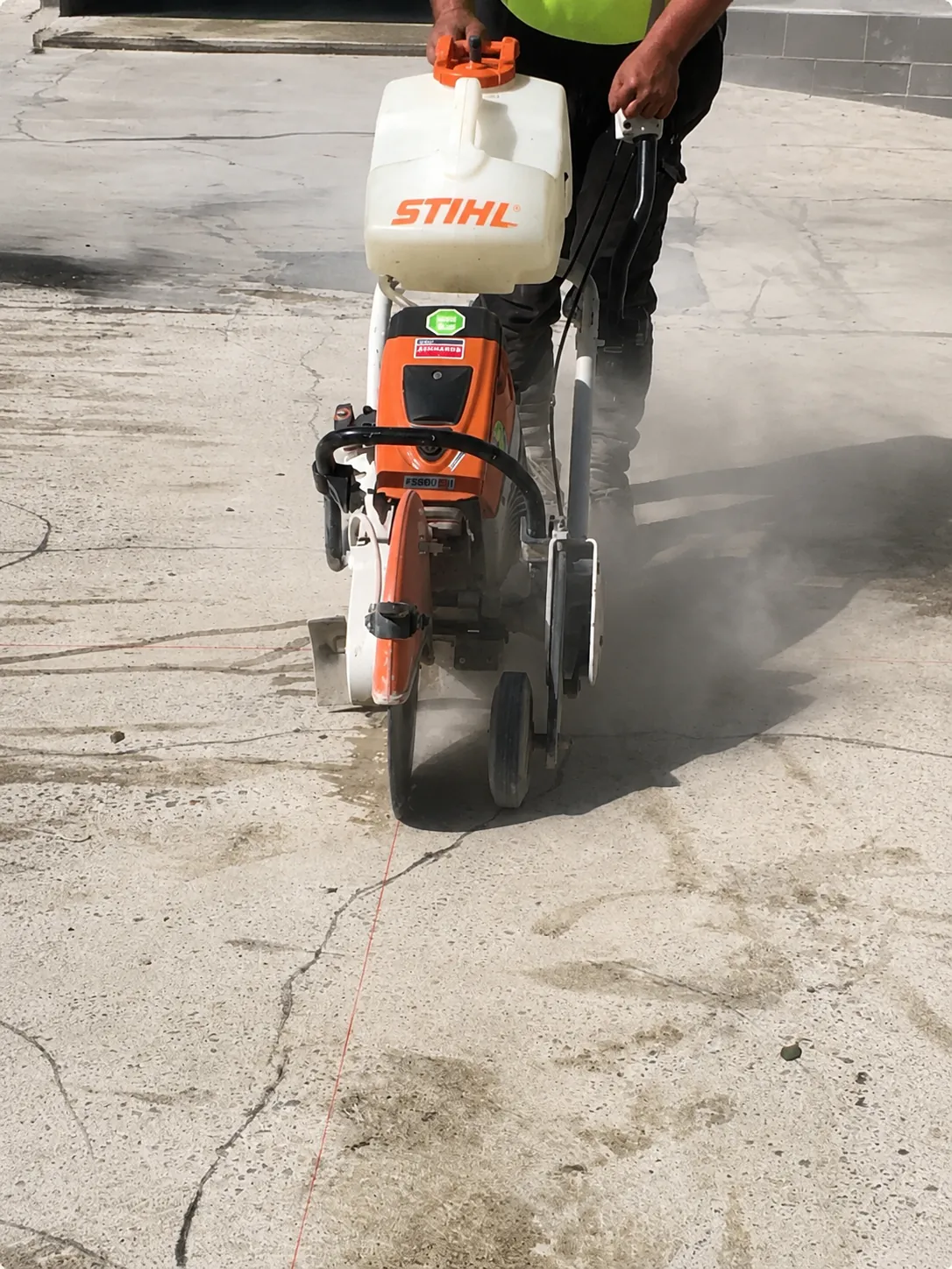 New control joints being cut into a Castle Hill concrete driveway
