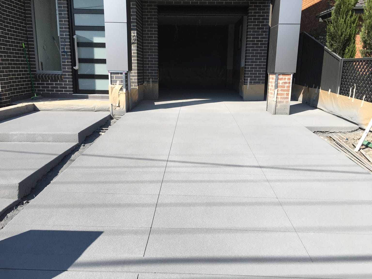 Black brick Lidcombe driveway before resurfacing angle two