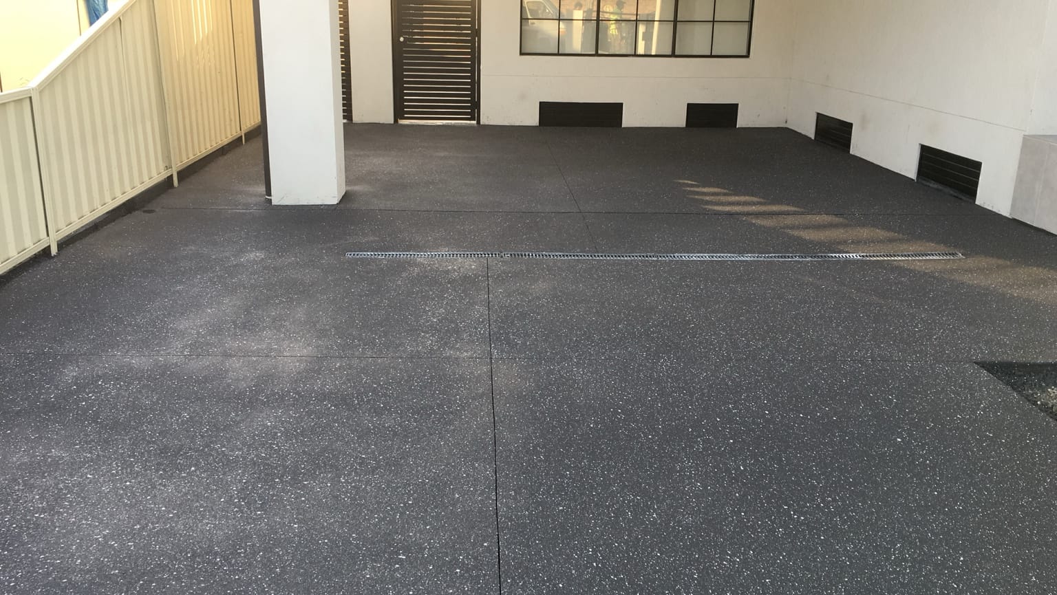 Same Lidcombe white-house driveway after Spray Crete resurfacing