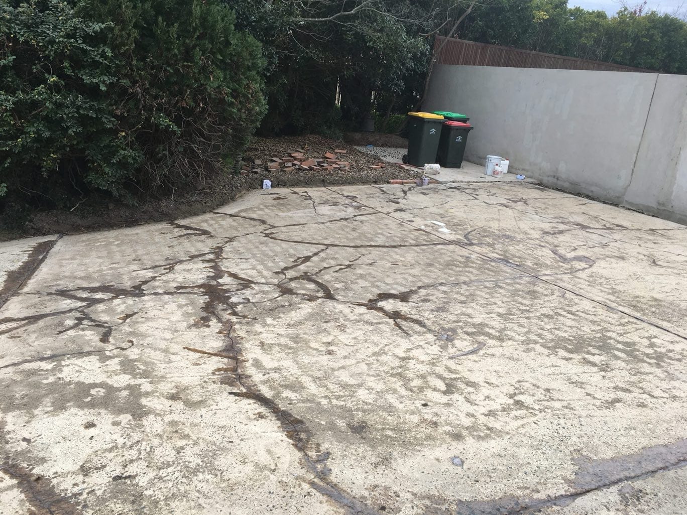 Cracked concrete surface assessed before professional repair and resurfacing